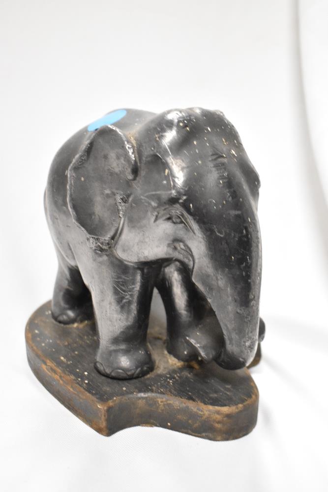 A cast lead elephant ornament displayed on a shield shaped plinth, 18cm x 20cm - Image 2 of 2