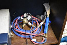 Two Oxygen and Acetylene gauges, also included is a bottle trolley.