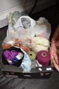 A box full of crafting wool, various colours and styles.