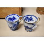 Two 19th century blue and white transfer pattern tea cups, having gilt heightening, AF.