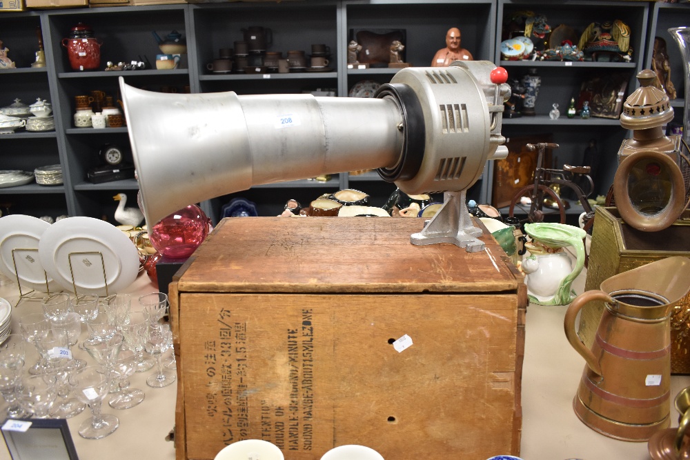 A vintage mountable loud speaker with wooden crate.