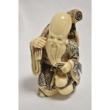 A 20th century cast and carved resin Chinese immortal, possibly Zhang Guolao 12cm