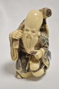 A 20th century cast and carved resin Chinese immortal, possibly Zhang Guolao 12cm