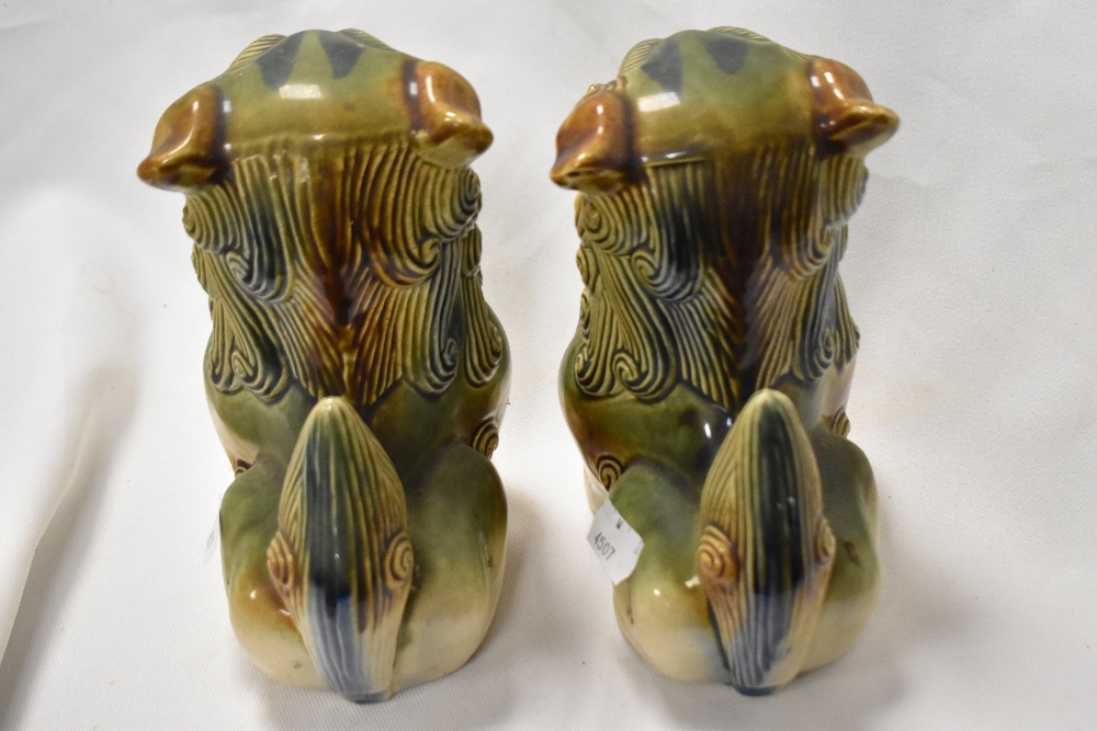 A pair of glazed pottery Foo Dog statues, measuring 18cm tall - Image 2 of 2