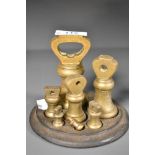 A good Victorian graduating brass weight set, comprising seven bell form weights 1lb-1/4oz all