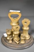 A good Victorian graduating brass weight set, comprising seven bell form weights 1lb-1/4oz all
