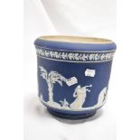 An Adams blue Jasper ware jardiniere, sprigged with classical figures within a landscape and below a