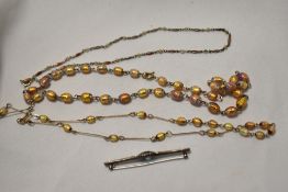 Two decorative opal style necklaces, an Art Deco brooch, and another chain