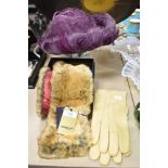 A pair of vintage suede gloves, a 1960s purple feathered hat and an as new faux fur scarf, having