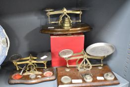 Three sets of postal scales and weights, to include Ensign scales and weights