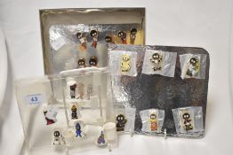 A group of Robertson jam jar novelties, to comprise enamelled pin badges and thimbles