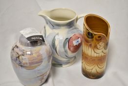 Three pieces of Poole pottery, including lustre finish ginger jar, 'Matisse' jug and cylindrical