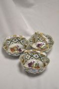 A group of three 'Royal Europe' ceramic baskets, decorated in the 19th century manner with foliate