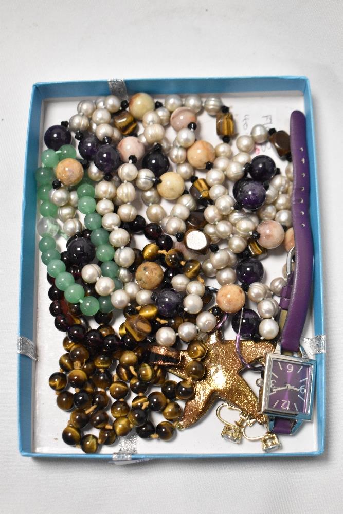 A box of mixed contemporary bead jewellery and a wristwatch