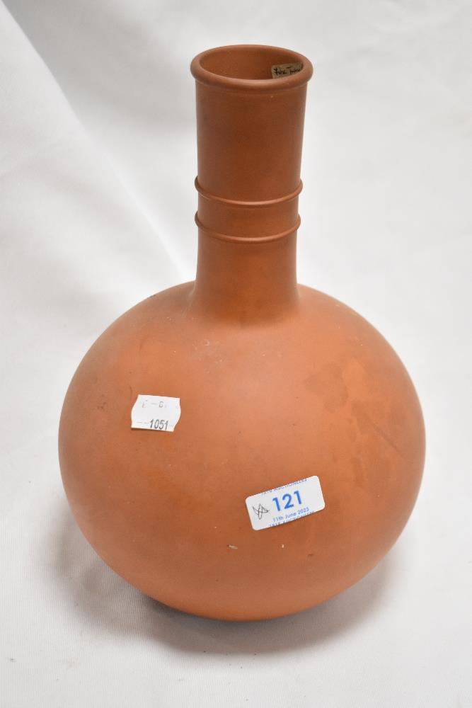 A nicely turned and proportioned terracotta vase, with slender knopped neck over the globular