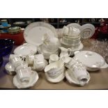 A quantity of Royal Doulton 'Twilight Rose' pattern tea and dinner wares, to include tureens,