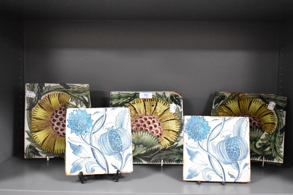 Five William De Morgan style glazed pottery tiles decorated with stylised flowers