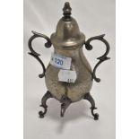 A miniature ornamental pewter samovar, of baluster form with domed finial topped cover over scrolled