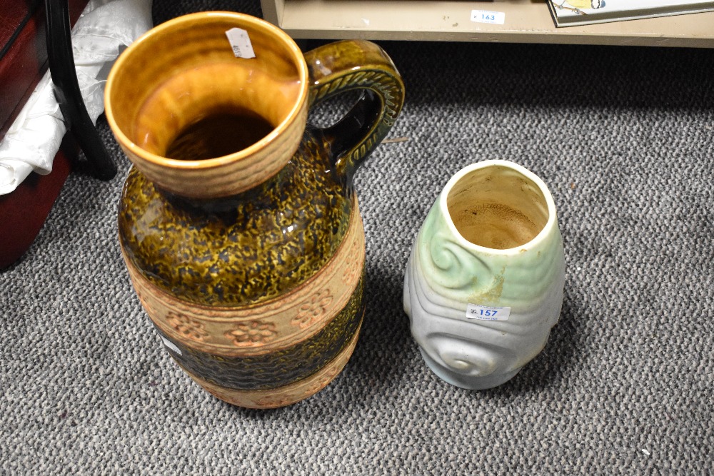 A large West German pottery vase, with single handle and bands of textured and impressed