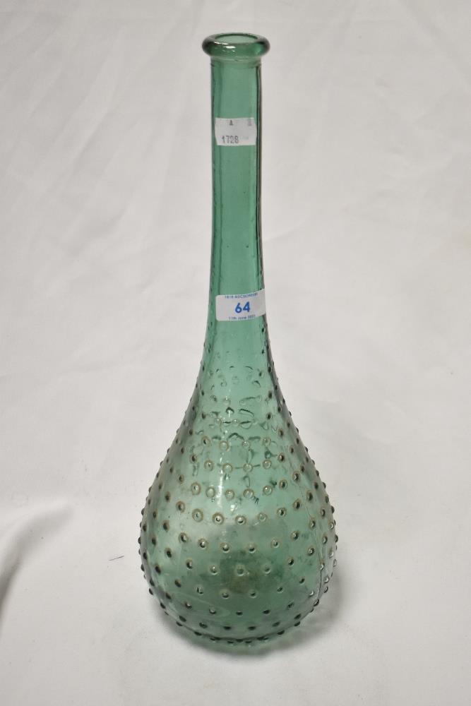 An interesting green glass vase, having dimple decoration, long neck, and measuring 40cm tall