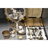 A group of mixed silver plated wares, salver, ladle, cup, chamber stick, spoons condiments etc