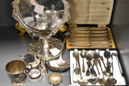 A group of mixed silver plated wares, salver, ladle, cup, chamber stick, spoons condiments etc
