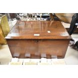 An early 20th century mahogany chest or box of simple form, void of key.