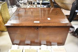 An early 20th century mahogany chest or box of simple form, void of key.