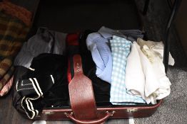 A suitcase full of mixed vintage and antique clothing, including 1960s/70s blouses, Mohair tartan