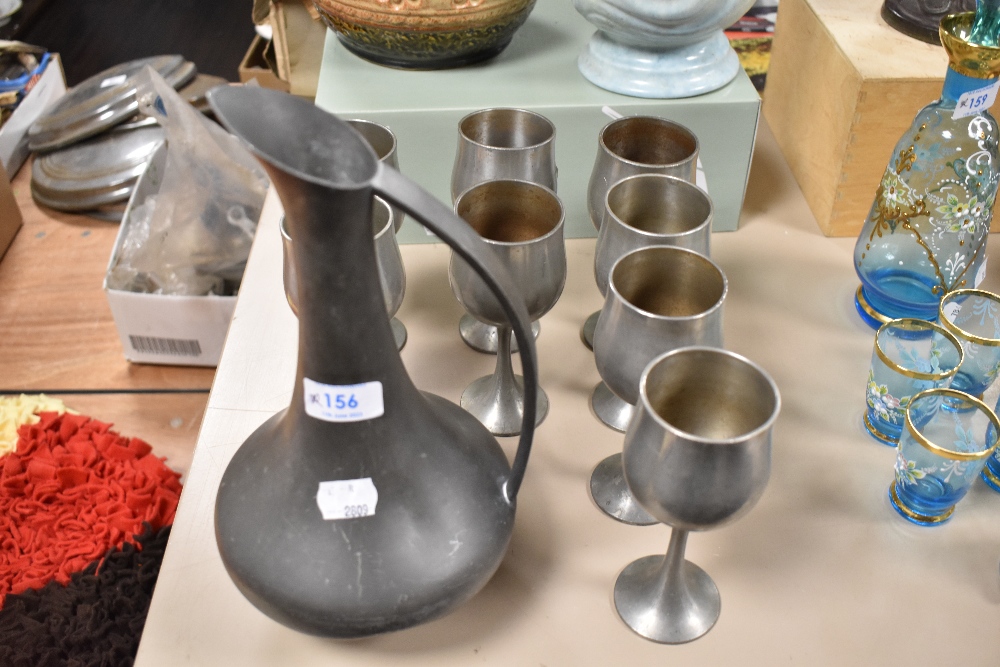 A Selango Pewter ewer and eight goblets, marks to underside