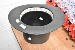 A retro plastic Moet Chandon advertising champagne bucket in the form of a top hat, Modele Depose,