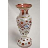 A 19th century Bohemian overlay glass vase, wheel-cut with apertures and painted with foliate
