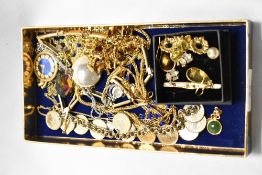 A box of various costume jewellery, to include gold coloured chains, a silver coloured chain with