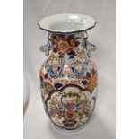 A 20th Century Chinese vase, decorated in Imari colours, having a flared rim, and six figure