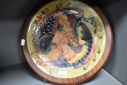 A large modern Moorcroft pottery 'Quiet Waters' pattern charger, designed by Philip Gibson and