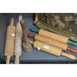 A group of vintage rolling pins and posser