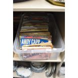 A box of Andy Capp and Giles books.