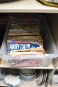 A box of Andy Capp and Giles books.