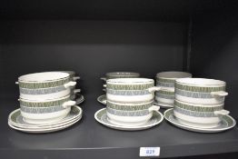 A set of vintage Midwinter soup bowls with plates.