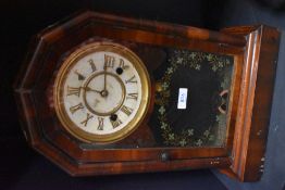 An early 20th century American mahogany cased wall clock, having painted detailing to glass door,