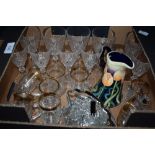 A small box of glassware comprising cut glass wine and spirit glasses, moulded tea cups and