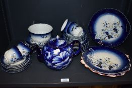 An early 20th century part tea service in a cobalt blue and gilt glaze.