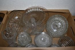 A selection of mixed pressed glasswares, vases, bowls, plate