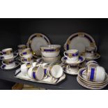 A collection of Alfred Meakin 'Bleu De Roi' table ware, having cobalt blue banding with gilt
