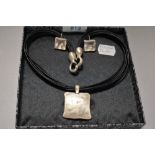 A modern Danon pewter necklace and earring set.