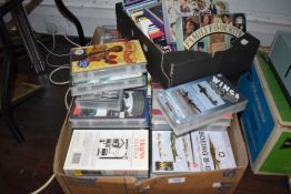 A box of VHS videos of various genre including cars, train and aeroplane interest, a box of cds
