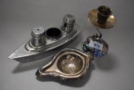 A mid century New Zealand paua shell candlestick, a plated strainer and a vintage novelty ship