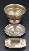 A Queen Elizabeth II silver ashtray, of canted rectangular form with moulded 'rests' the dished