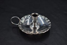 A Victorian silver 'Go-to-Bed' miniature chamber stick, the central vase form socket with bead