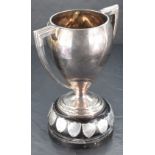 A good George V silver two-handled trophy of Art Deco design with tapering body, angular handles and